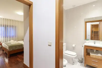 a living room with a large flat screen tv on the wall at ON Apartments - Family Retreat in Porto