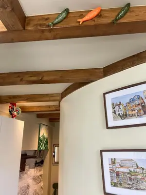 a room with wooden beams and carrots on the ceiling at Cosy HouseTypical Space in Porto by Su e Luís in Porto