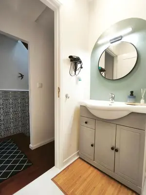 a bedroom with a large bed and a window at Casa da Lapa Porto in Porto