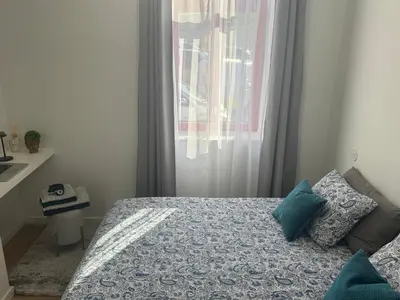 a bedroom with a bed and a window at CreaConfort Casa Boa Jóia de Campanhã in Porto