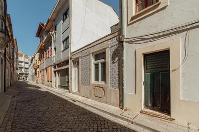 an empty street in an old city with buildings at Downtown Cosy Apartment by Vacationy in Porto