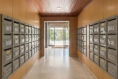 a row of lockers in a room with a door at Vilar 210 in Porto