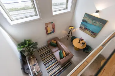 an overhead view of a living room with a couch at Design loft, Downtown Porto in Porto