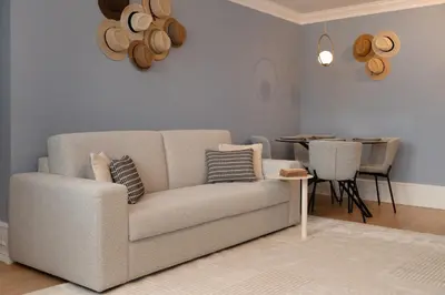 a living room with a couch and a table at Ribeira Apartments Flores in Porto