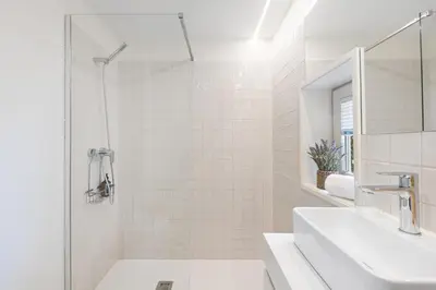 a white room with a table and chairs at Studio Glow | 111 Collection in Porto