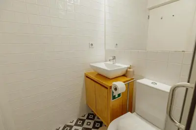 a bathroom with a sink and a toilet at Bonfim 362 by Vacationy in Porto