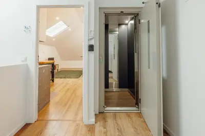 a hallway with a door leading into a room at Rooftop Constituicao by Vacationy in Porto