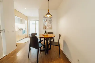 a dining room with a table and chairs at Elegant Marques Duplex by Vacationy in Porto