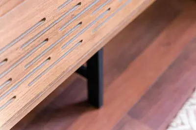 a wooden table sitting on top of a wooden floor at Studio-Fast Wi-Fi- AC -5 min Trindade Metro&Clérigos in Porto