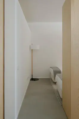 a room with a window and a table and a lamp at Urban Residences Sacadura in Porto