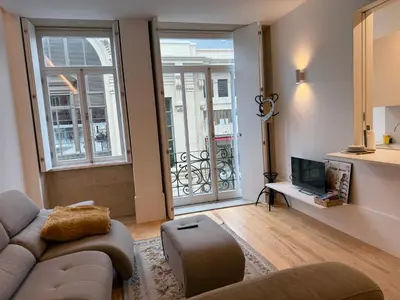 a kitchen with white cabinets and a sink at Apartments City Center- Market Bolhão in Porto