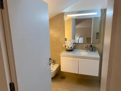 a bathroom with a toilet and a sink at Apartments City Center- Market Bolhão in Porto