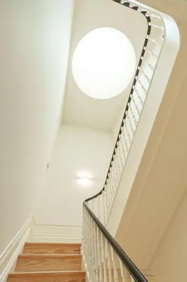 a white staircase with a round ceiling at VIVA Quinta Modernista Flat in Porto