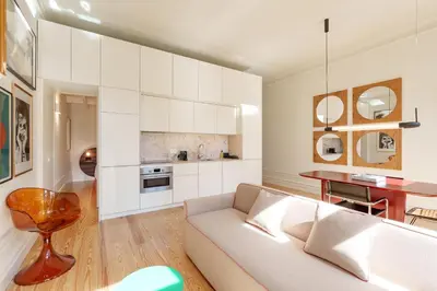 a living room with a couch and a table at VIVA Quinta Modernista Flat in Porto