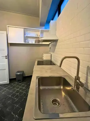 a kitchen with a sink and a counter top at Good end Oporto View in Porto