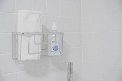 a towel rack in a bathroom with towels at GuestReady - Urban retreat in Boavista in Porto