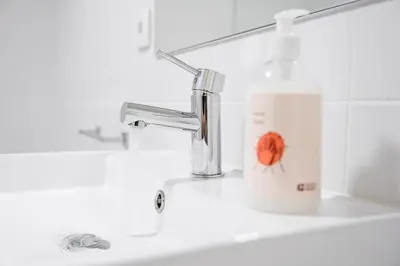 a bathroom sink with a faucet and a coffee cup at GuestReady - Urban retreat in Boavista in Porto