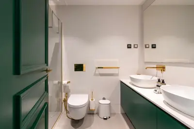 a bathroom with two sinks and a toilet at Cosy Flat in Porto with Private Patio & Garden Area by Lisbeyond in Porto