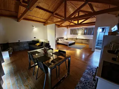 a living room with a couch and a table at Estúdio na Estação in Porto