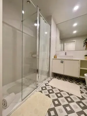 a bathroom with a shower and a sink at Terrace Loft near Porto Center in Porto