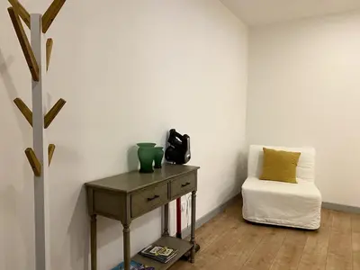 a room with a table and a chair in a room at City Center Private Parking AC in Porto