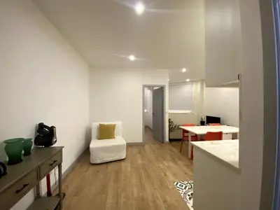 a living room with a kitchen and a dining room at City Center Private Parking AC in Porto