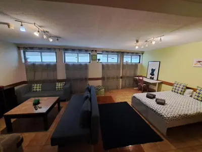 a living room with a couch and a table at Center Porto Economic Huge Flat in Porto
