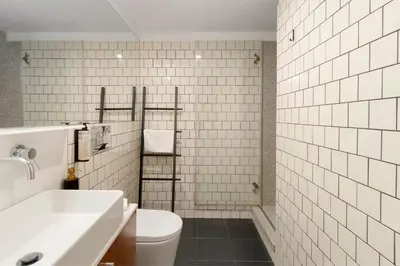 a white bathroom with a sink and a toilet at Orange Apartments B in Porto