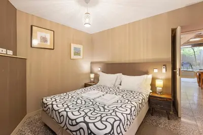 a bedroom with a bed with two shoes on it at Orange Apartments A in Porto