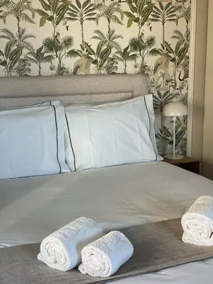 a bed with two white pillows on top of it at Casa de Duque de Loulé - Apartments by RealuptownPorto in Porto