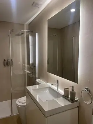 a bathroom with a sink and a toilet and a mirror at Casa de Duque de Loulé - Apartments by RealuptownPorto in Porto