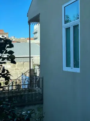 a white building with a window on the side of it at Casa de Duque de Loulé - Apartments by RealuptownPorto in Porto