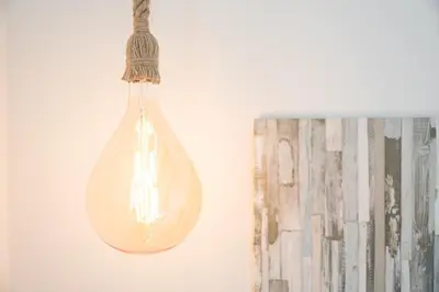 a glass light bulb hanging from a wall at GuestReady - Enjoy Comfort in Porto in Porto