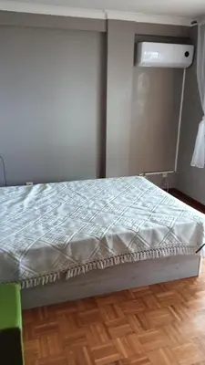 a bed in a room with a window at Fabulous Antero De Quental in Porto