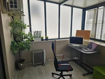 an office with a desk with a laptop and a chair at Fabulous Antero De Quental in Porto