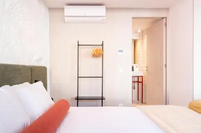 a bedroom with a bed and a room with a closet at Bainharia 82 by LovelyStay in Porto