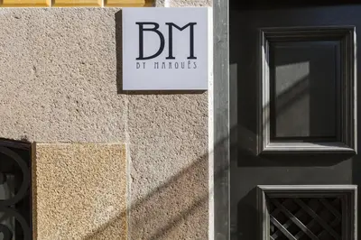 a sign on the side of a building at BO - Marquês Apartments in Porto