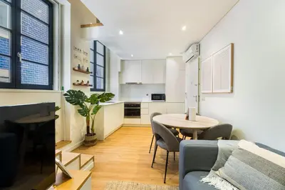 a living room with a couch and a table at GuestReady - Peaceful haven in Porto in Porto