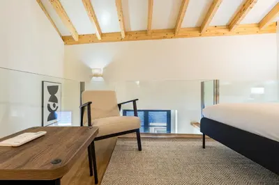 a bedroom with a bed and a desk and a chair at GuestReady - Peaceful haven in Porto in Porto