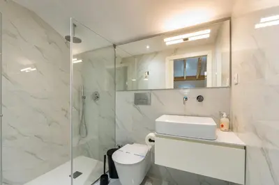 a bathroom with a shower and a toilet and a sink at GuestReady - Peaceful haven in Porto in Porto