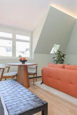 a living room with a couch and a table at Bolhão Luxury Apartments in Porto