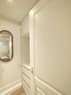 a white room with a mirror and a closet at Elegant duplex, WiFi, Porto center in Porto