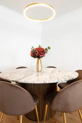 a table with a vase with flowers on it at Bonjardim Signature Apartment 4B in Porto