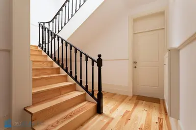 a staircase in a home with wooden floors and a door at Blu Constellation - Santa Catarina in Porto