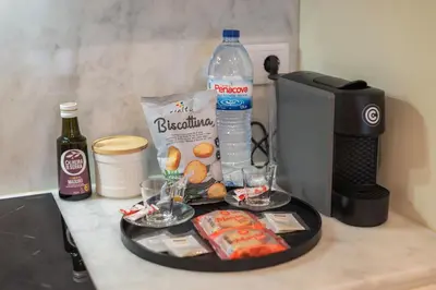 a table with a tray of food and a bottle of water at Luxury Style 10 with AC Downtown Porto near Metro in Porto