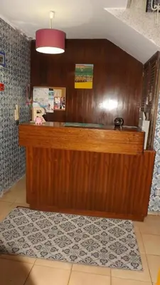 a wooden counter top in a room with at Porto Central Hostel in Porto