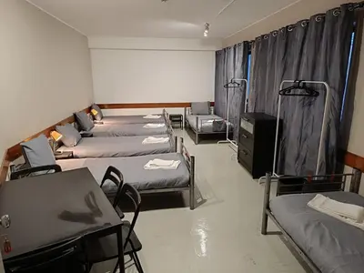 a group of beds in a room at Porto Central Hostel in Porto