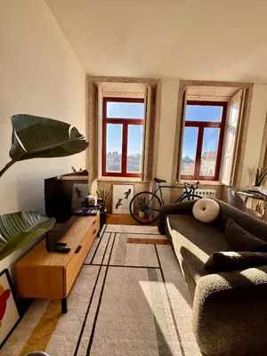 a living room with a couch and a coffee table at Bonfim cozy apartment Porto in Porto
