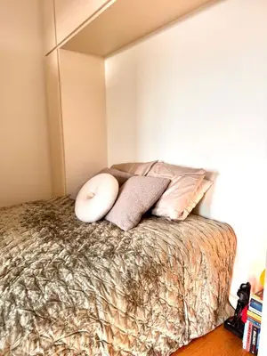 a bedroom with a bed with pillows on it at Bonfim cozy apartment Porto in Porto