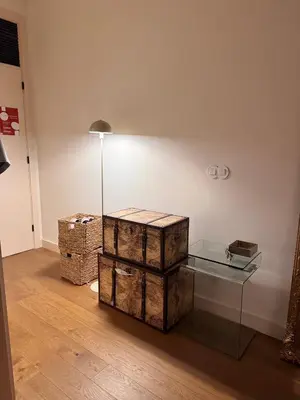 a room with boxes and a glass table at Bonfim cozy apartment Porto in Porto
